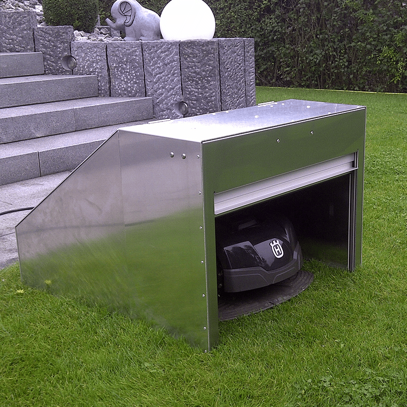 Robot mower shelter with aluminium roller shutters Robot mower shelter with aluminium roller shutters
